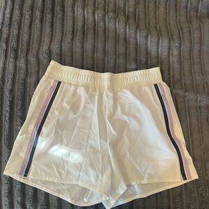Calme White Women’s Athletic Shorts with Purple and Navy Side Stripes